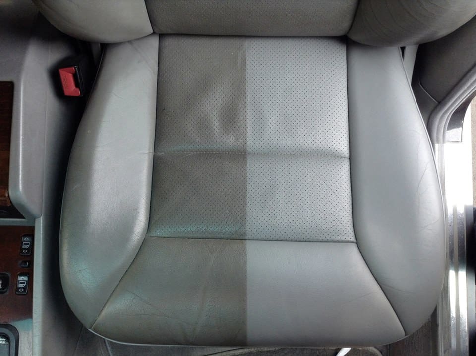 Before-and-after of a leather car seat showing one half deep-cleaned during a San Diego interior detail