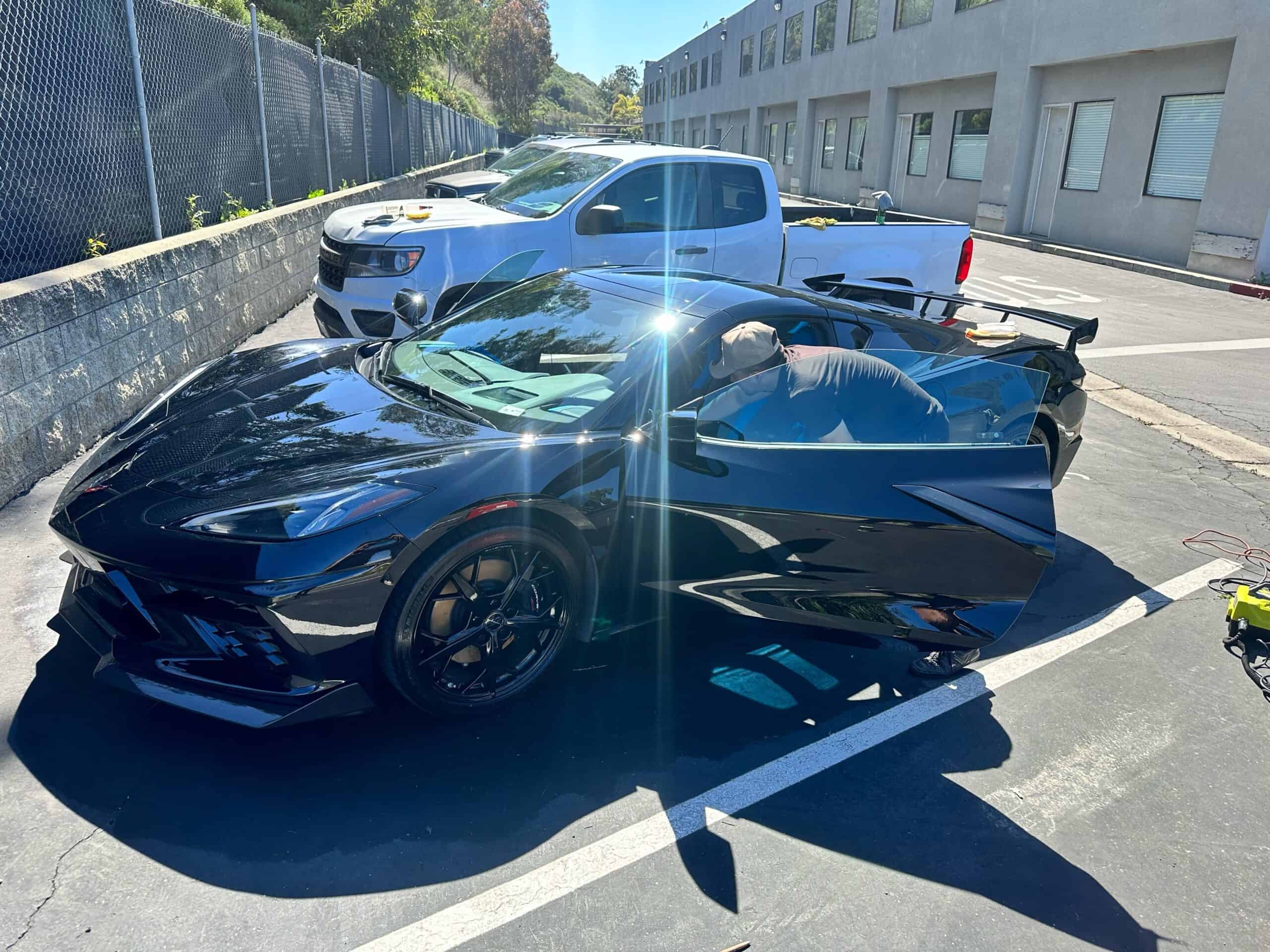 Black Corvette gleaming after a complete inside-and-out mobile detail in San Diego